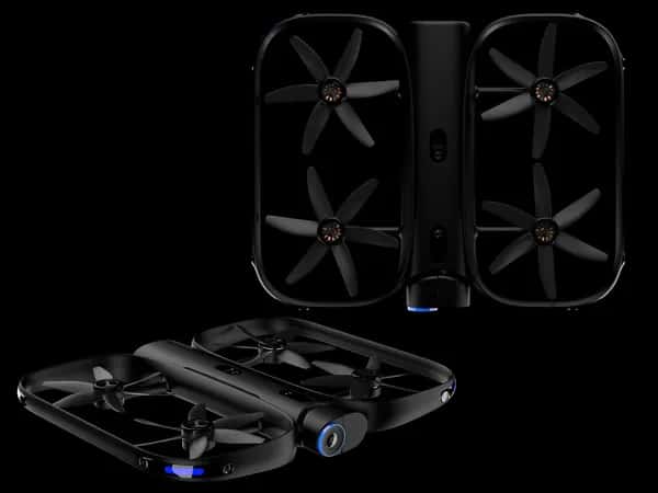 Skydio R1 — два ракурса чёрного дрона с двумя прямоугольными секциями, в которых размещены четыре ротора, а также множество камер.