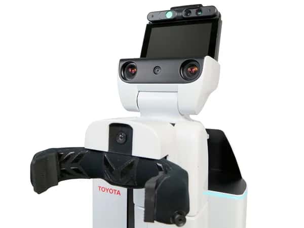 Human Support Robot — чёрно-белый робот с чёрным когтеобразным захватом на корпусе и головой из камер и планшетного дисплея.