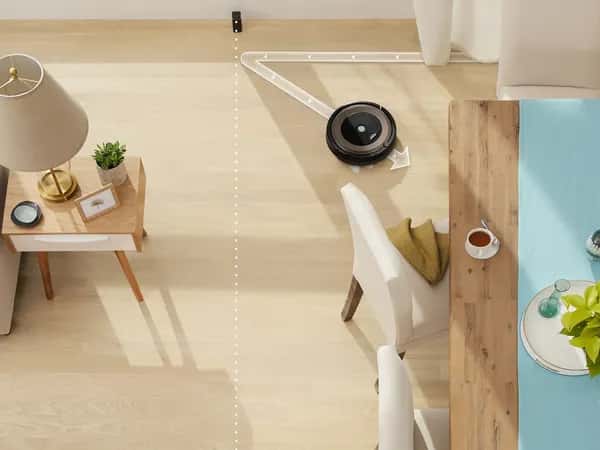 Roomba — фотоиллюстрация: робот убирает дом, линиями обозначены границы зон уборки.