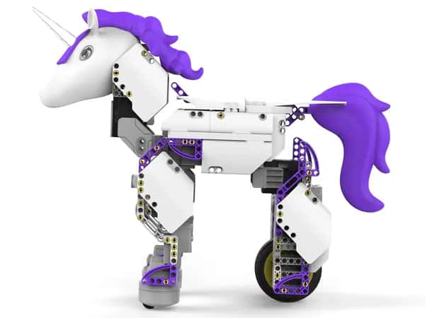 UnicornBot — вид сбоку на фиолетово-белого единорога с белым рогом и колёсами, собранного из множества небольших простых пластиковых деталей.