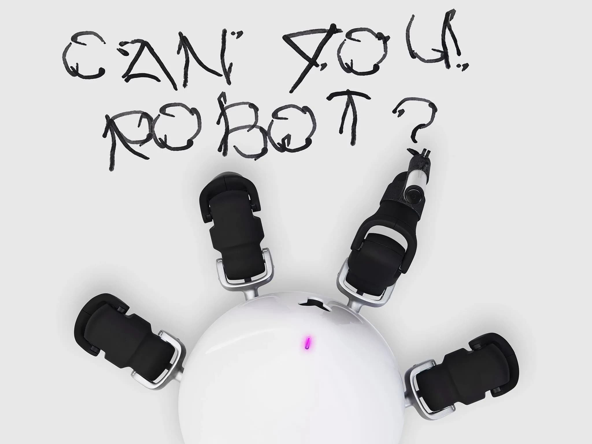 Одна из четырёх видимых ног HEXA держит маркер — робот написал «Can you robot?».