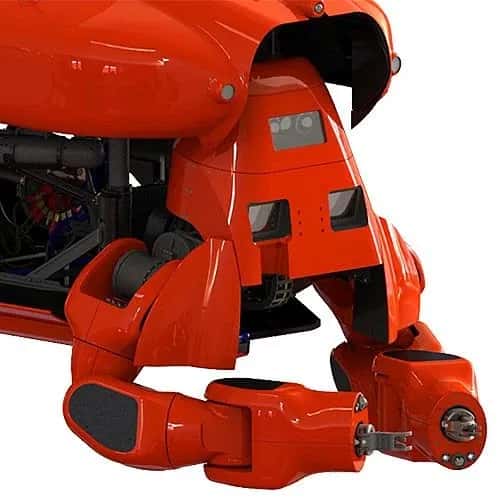 Aquanaut — крупный план красного робота в форме подводной лодки с захватными манипуляторами.